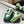 MID-TOP SNEAKERS IN WHITE PERFORATED LAMBSKIN AND GREEN SUEDE