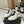 MID-TOP SNEAKERS IN WHITE AND BLACK TRIM PERFORATED LAMBSKIN