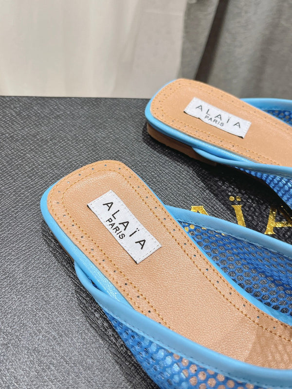 MULES PIATTI ALAIA IN RETE BLU CERULEO