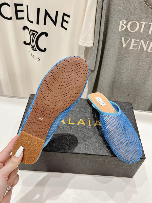 MULES PIATTI ALAIA IN RETE BLU CERULEO