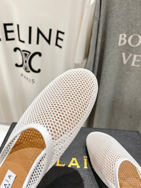 MULES ALAIA FLAT IN RETE BIANCA