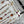 LV 25 Decorative Pattern Gemstone Chain Pleated Skirt White Poliester