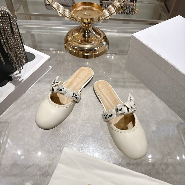 CD 26 Bow Flat Mules Embroidered Sheepskin