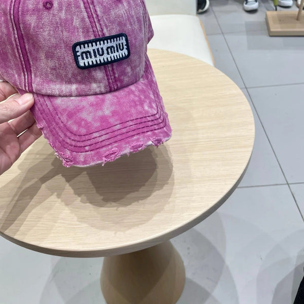 MM DISTRESSED FABRIC BASEBALL CAP IN PINK WITH EMBROIDERED LOGO