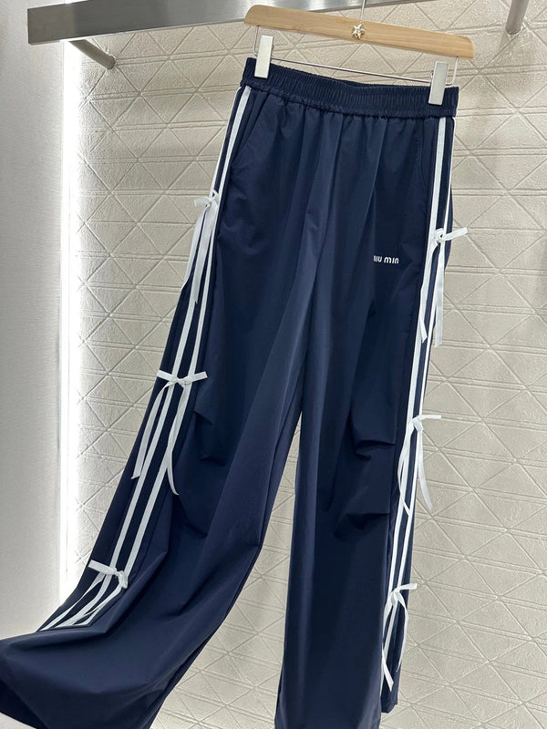 MIUMIU HIGH-WAISTED WIDE-LEG PANTS WITH BOW 276652