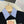 Polo Miumiu 2026 à rayures et patchwork en coton noir et bleu
