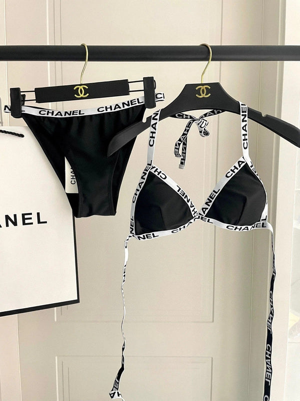 Completo costume da bagno bikini nero con finiture bianche 627832