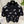 Polo Chanel 2026 en coton noir et blanc à imprimé floral