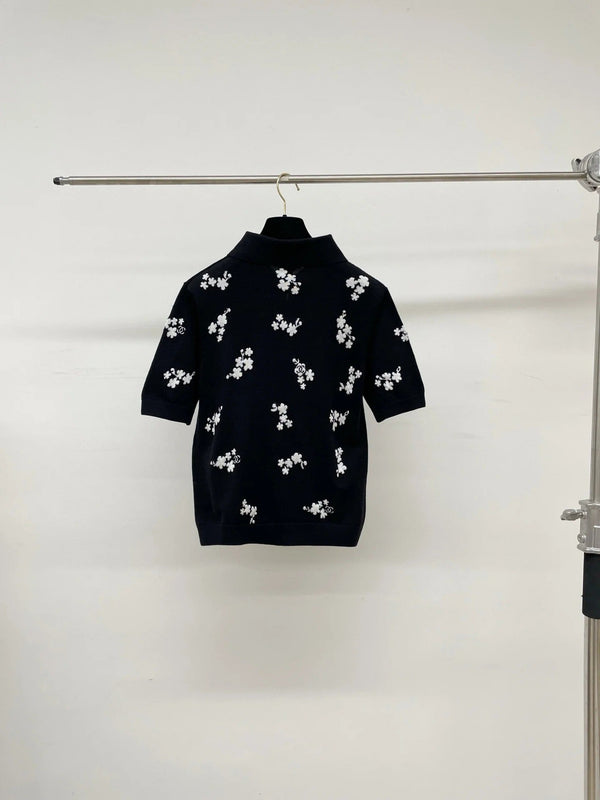 Polo Chanel 2026 en coton noir et blanc à imprimé floral