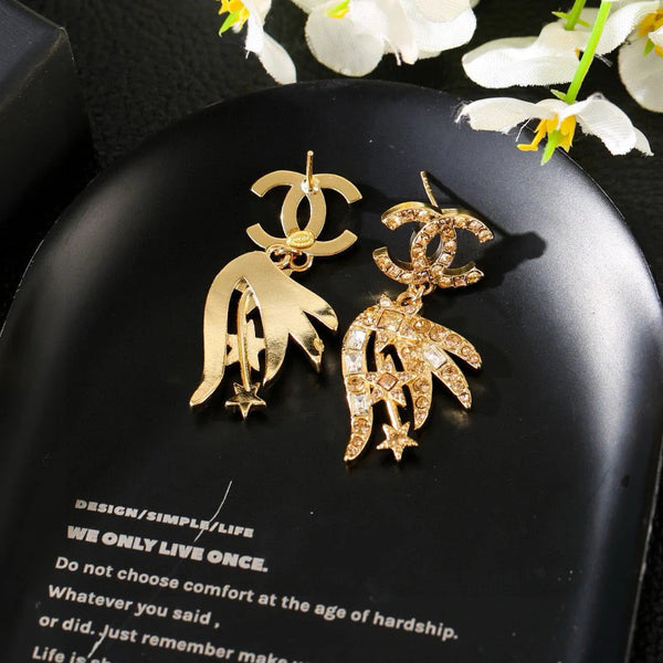 Boucles d'oreilles pendantes CC Strass Star en or et diamant