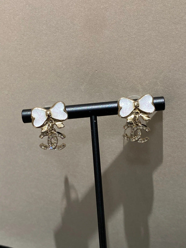 Boucles d'oreilles nœud papillon en or à pampilles fines pétillantes CC