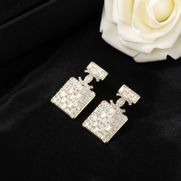 Boucles d'oreilles en or et diamant flacon de parfum CC