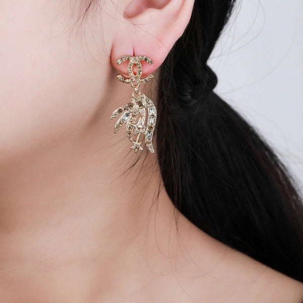 Boucles d'oreilles pendantes CC Strass Star en or et diamant