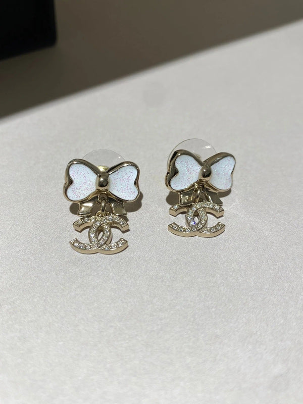 Boucles d'oreilles nœud papillon en or à pampilles fines pétillantes CC