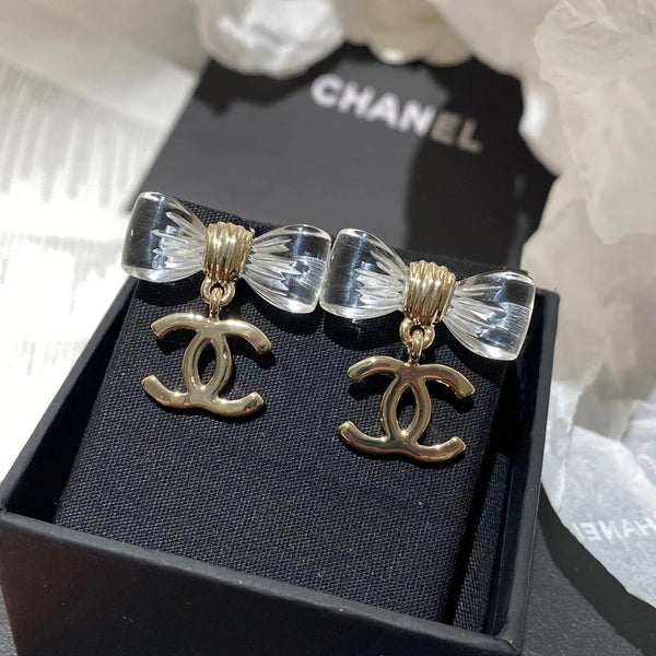Boucles d'oreilles nœud en acrylique transparent CC doré