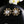 Boucle d'oreille clou mini CC en or et diamant noir