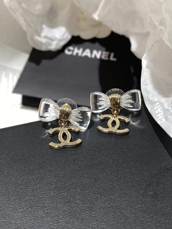 Boucles d'oreilles nœud en acrylique transparent CC doré