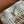 WANDER BUCKET BAG 23 WHITE IN RAFFIA WITH LEATHER TRIM