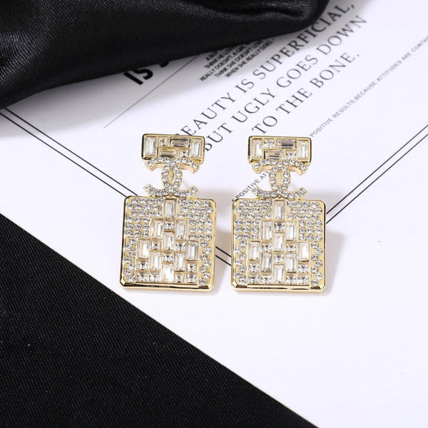 Boucles d'oreilles en or et diamant flacon de parfum CC