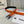 CC 30MM BELT IN FIRE ORANGE GRAINED CALFSKIN WITH NAVY BLUE METAL LOGO