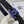 CC 30MM BELT IN BLACK GRAINED CALFSKIN WITH NAVY BLUE METAL LOGO