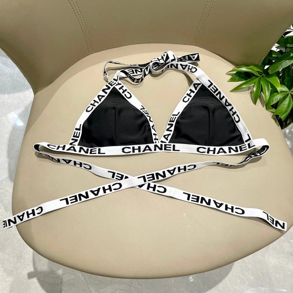 Completo costume da bagno bikini nero con finiture bianche 627832