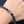 BRACCIALE IN ARGENTO CON PIETRA NERA MONOGRAM LV
