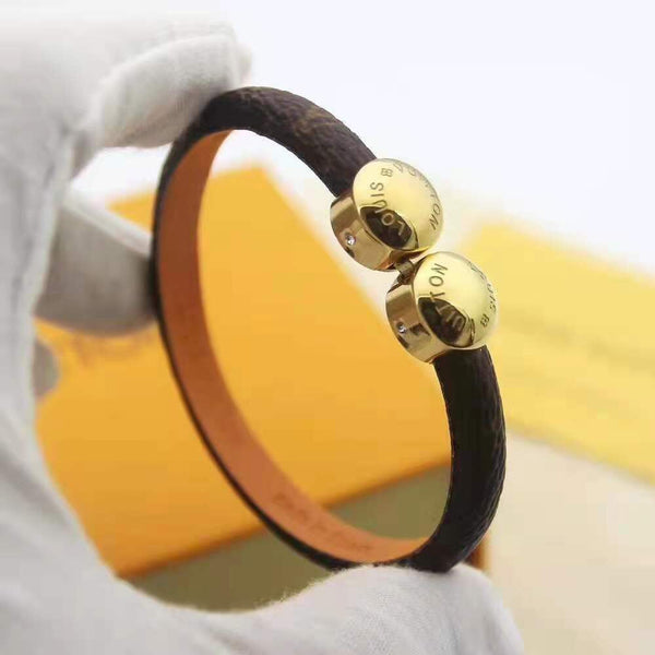 BRACCIALE IN ORO CON 2 MOTIVI IN CORDA DI PELLE LV