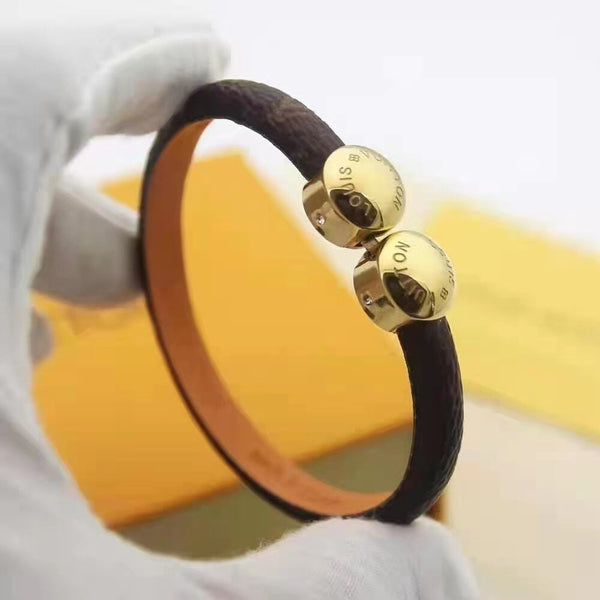 BRACCIALE IN ORO CON 2 MOTIVI IN CORDA DI PELLE LV