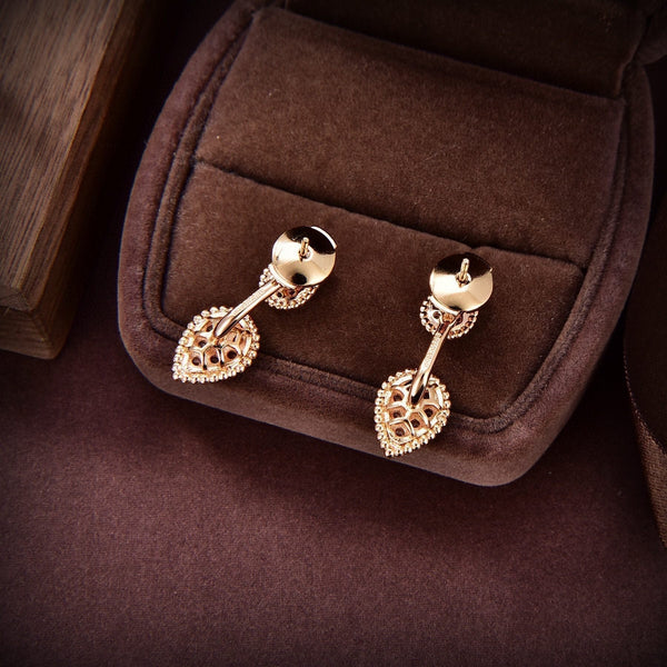 ORECCHINI SERPENT BOHEME IN ORO ROSA CON DIAMANTI A FORMA DI C