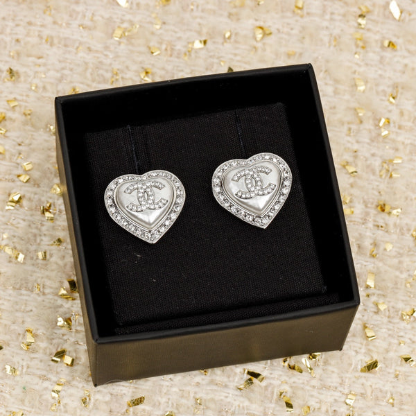 ORECCHINI IN ARGENTO CON CUORE E DIAMANTI CC INTORNO