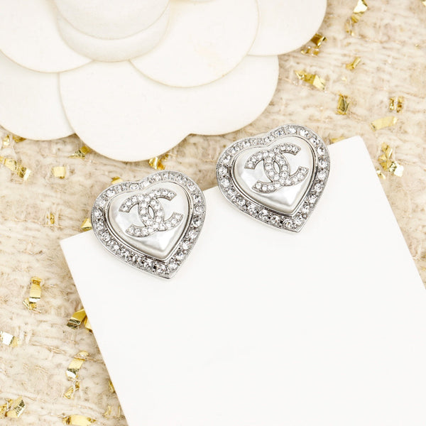 ORECCHINI IN ARGENTO CON CUORE E DIAMANTI CC INTORNO