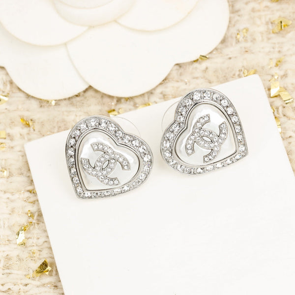ORECCHINI IN ARGENTO CON CUORE E DIAMANTI CC INTORNO