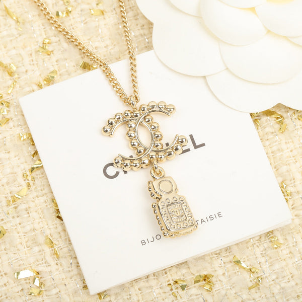 COLLANA IN ORO CON PENDENTE A FORMA DI BOTTIGLIA DI PROFUMO CHANE